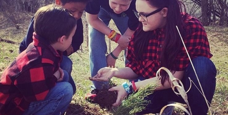 students assessing the soil and plants.