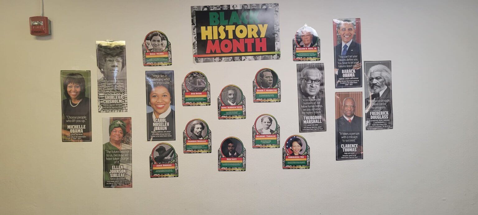 Macomb Montessori Academy students decorate their wall with African American icons from Martin Luther King Jr. to Rosa Parks.