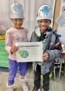 Two NBCA students pose for a picture after winning an award for sustainability in the classroom following earth day.