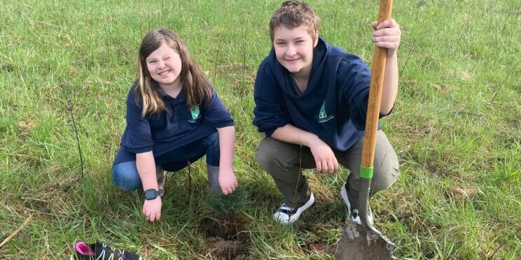 WMAES Students plant a tree together in the 62-acre campus in celebration of earth day at their school.